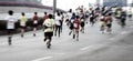 Marathon runners running on the street